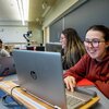 3 women studying together with their laptops