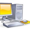 A grey computer system with a yellow screen and mouse pad
